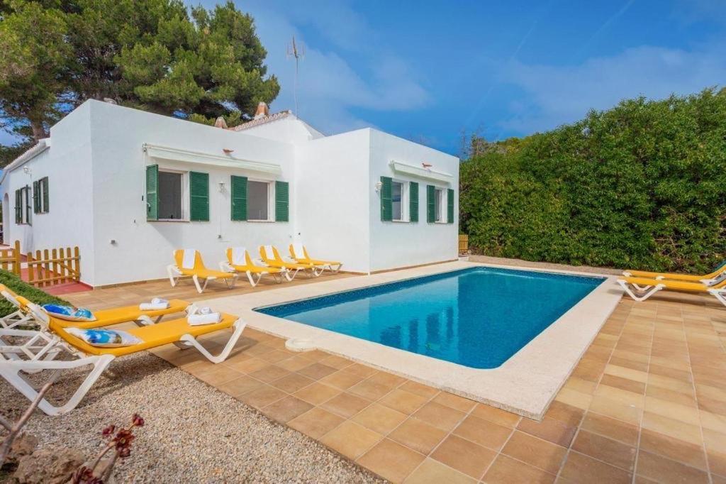 Casa Con Piscina Compartida En Addaia Holiday home